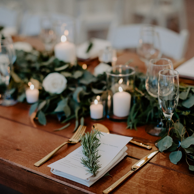wedding tablescape with farm table and gold flatware rentals at Willowdale Estate on North Shore MA
