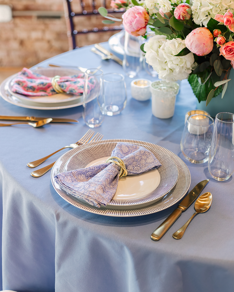 colorful napkin and rental plates at place setting