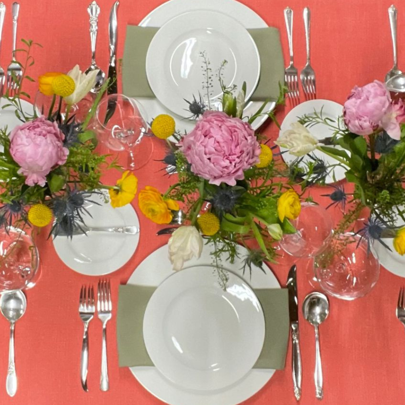 Wedding rental linen, coral tablescape with green napkins, Boston, Massachusetts