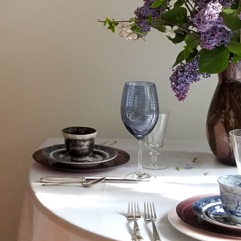 Ivory cotton blend tablecloth set with glasses, plates and silverware for Springfield Massachusetts event