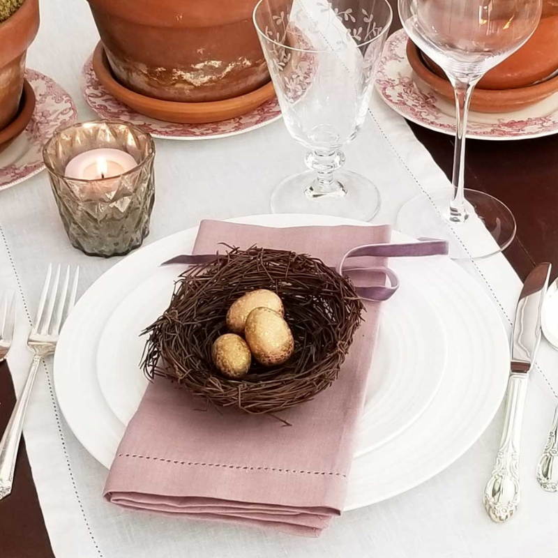Hemstitch linen napkin in Rosewood with birds nest at place setting Massachusetts, New England