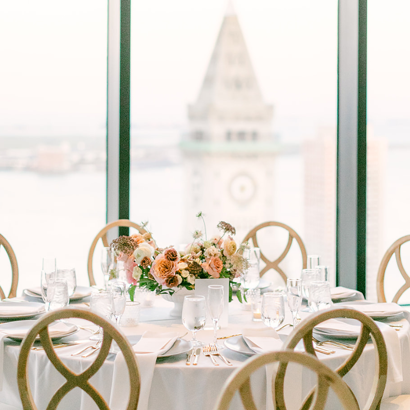 State Room party with cotton blend linen overlooking Boston Harbor waterfront