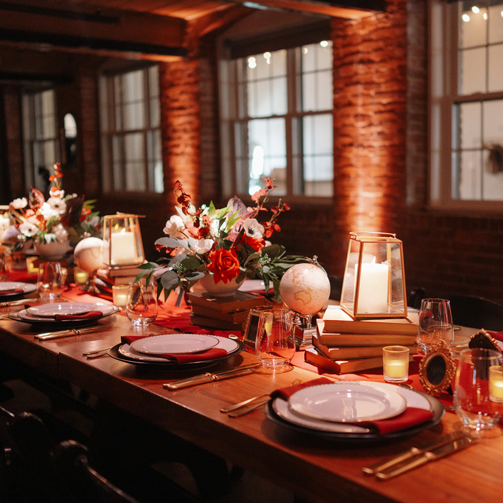Library inspired wedding with lanterns, globes and other rental decor create a moody tablescape in MA.
